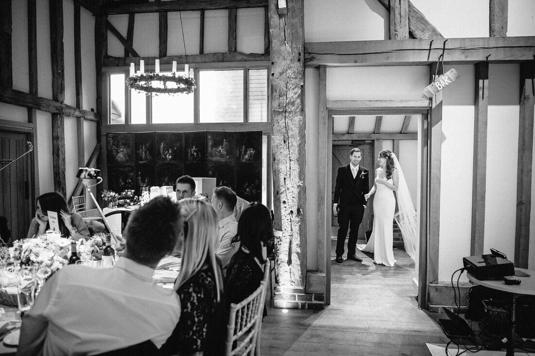 husband and wife wait before entering the reception
