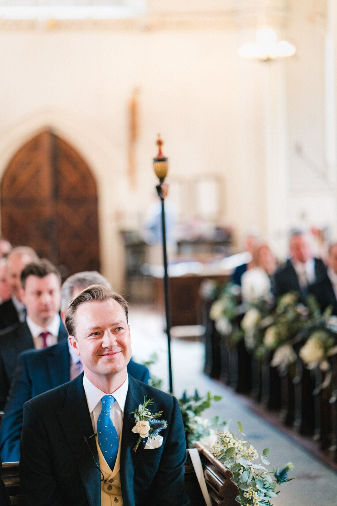 the groom waits patiently for the bride