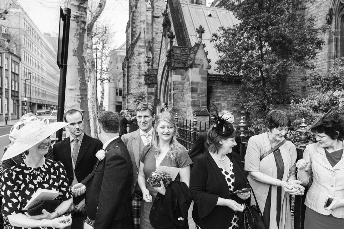 wedding guests prepare for the confetti 