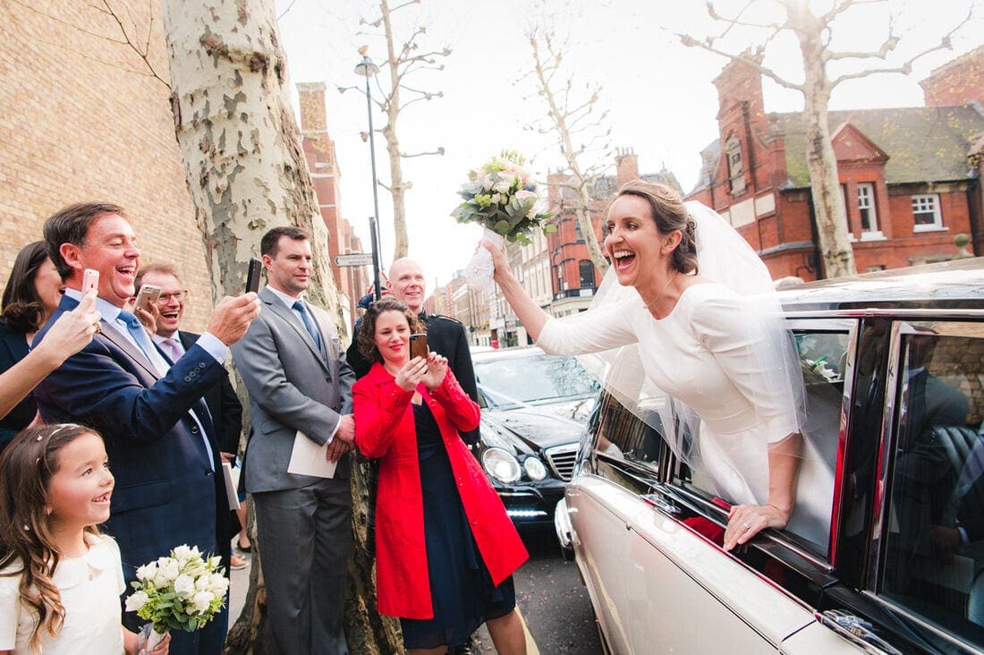 the bride soaking up the crowds of friends and well wishers