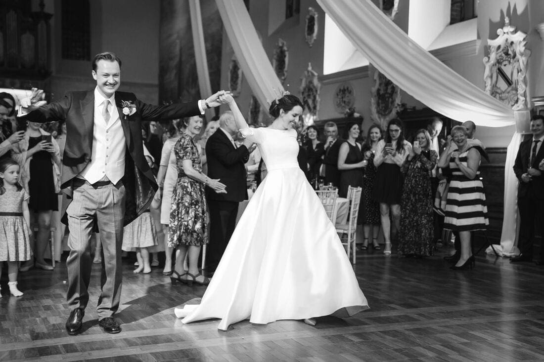 welcoming the bride and groom to the dance floor 