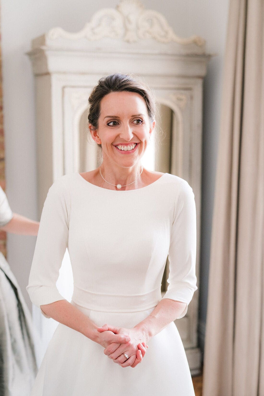 a very excited bride in her wedding dress