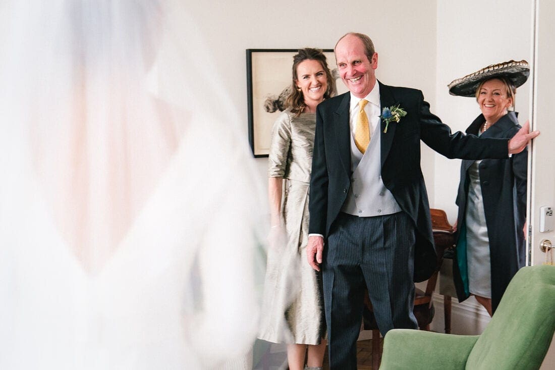 dad sees his daughter in her wedding dress for the first time