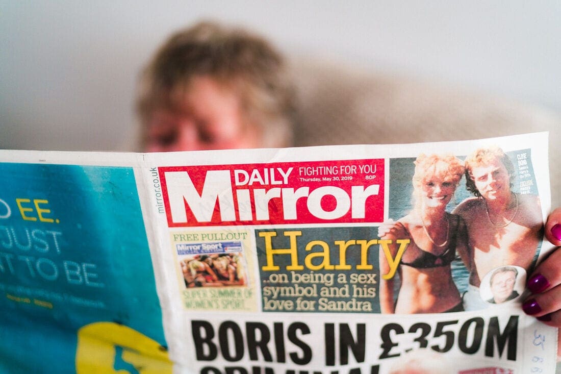 mum reading newspaper on the morning of the wedding