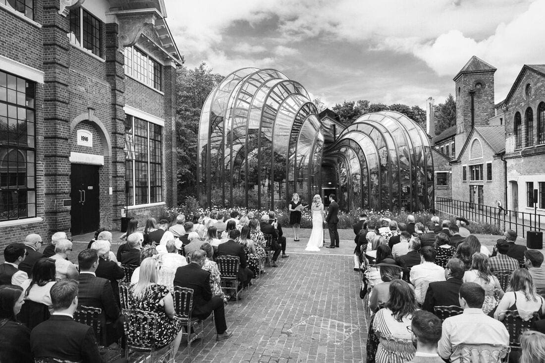 wedding in front of the glasshouse at Bombay Sapphire Distillery Hampshire
