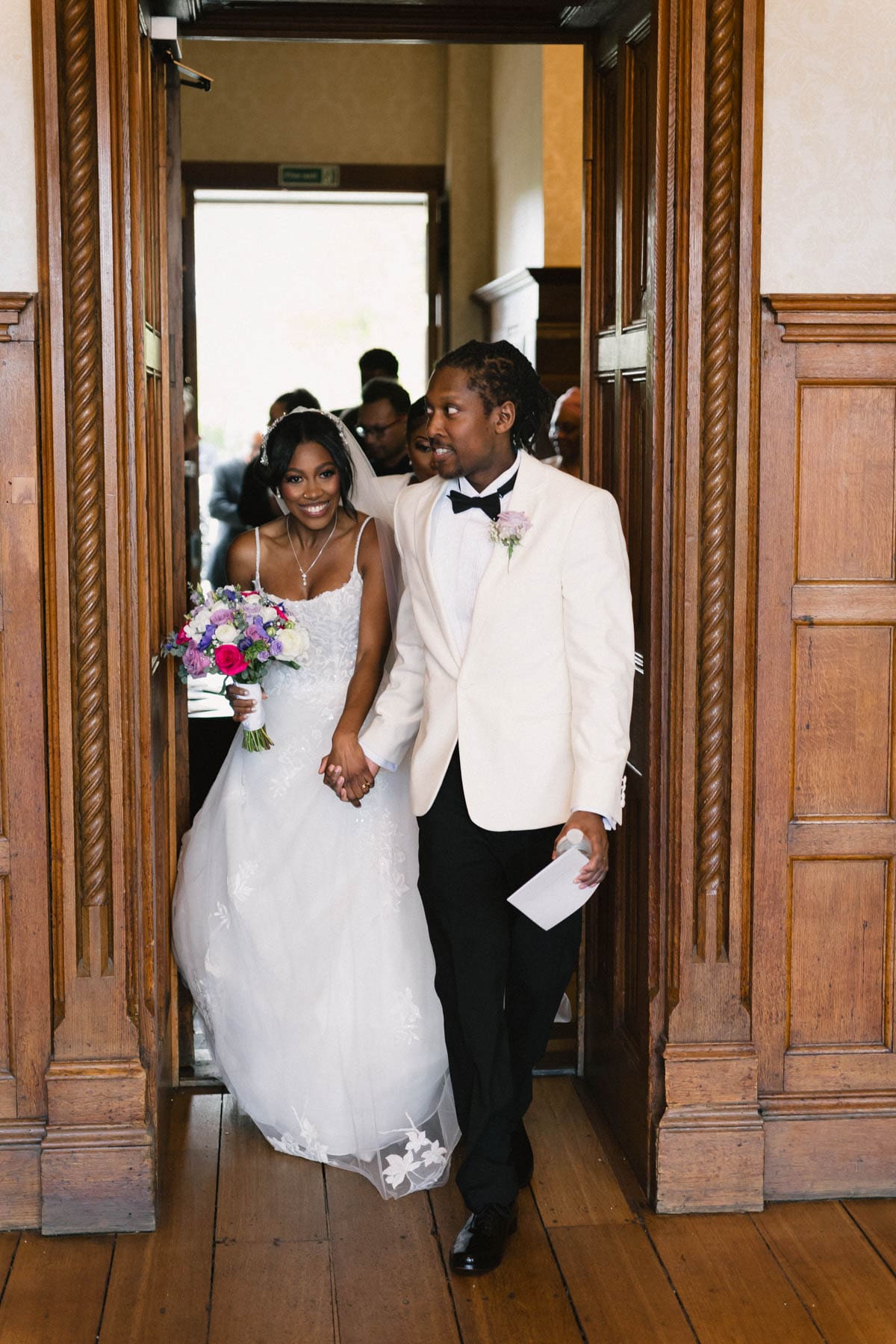 married couple arrive at Froyle Park